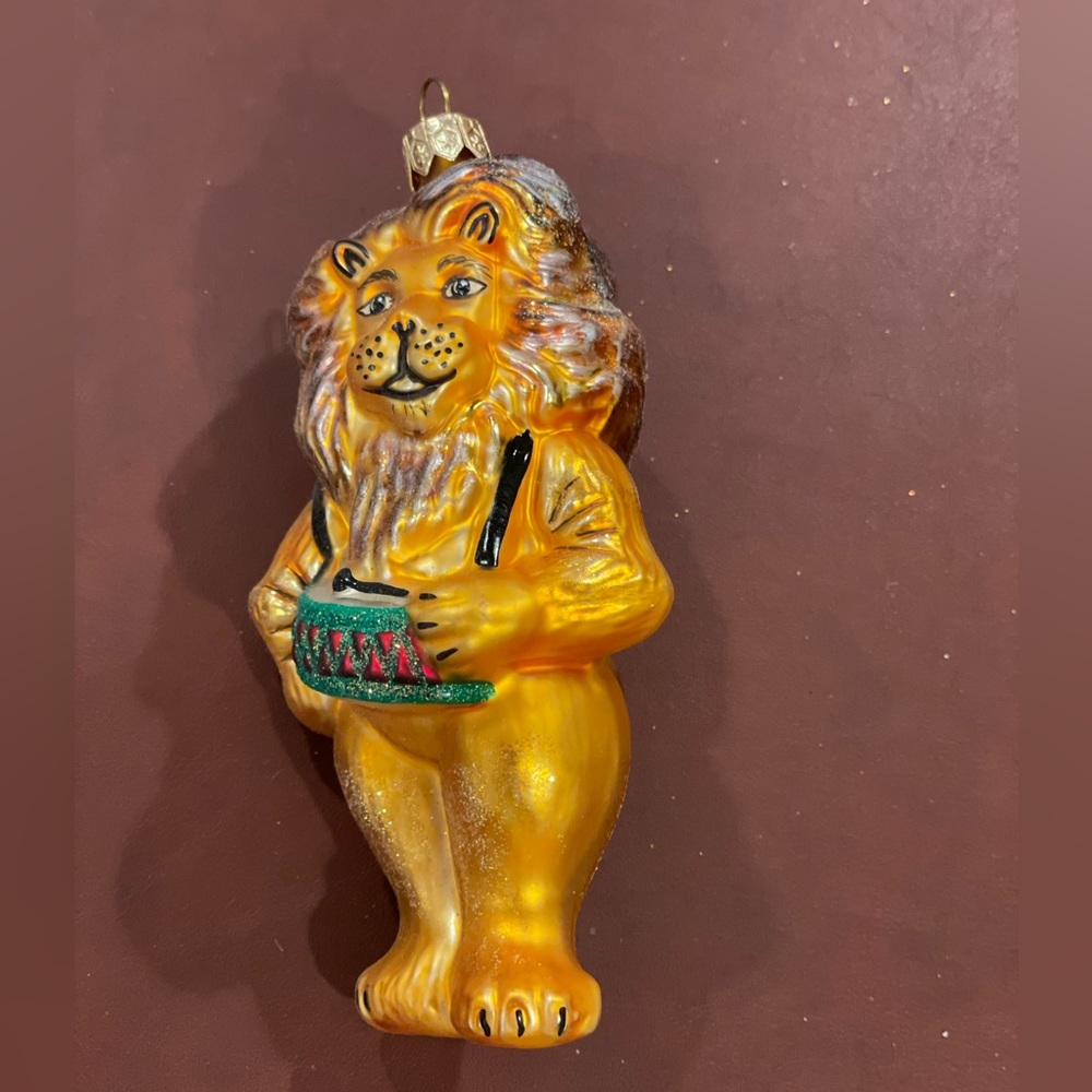 Lion playing drums blown glass Christmas ornament